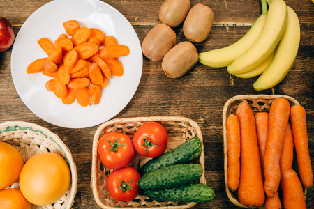 Fruits and vegetables on wooden table, top viewの写真素材