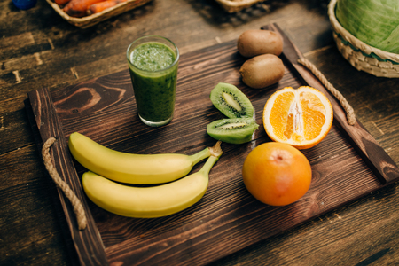 Fruits on wooden tray closeup, nobody, top viewの写真素材
