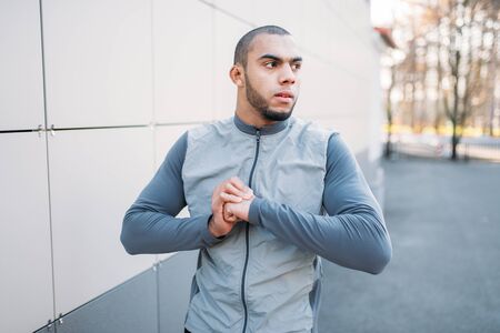 Male jogger on fitness workout in autumn parkの写真素材