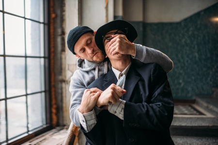 Aggressive addict with knife attack his victimの写真素材