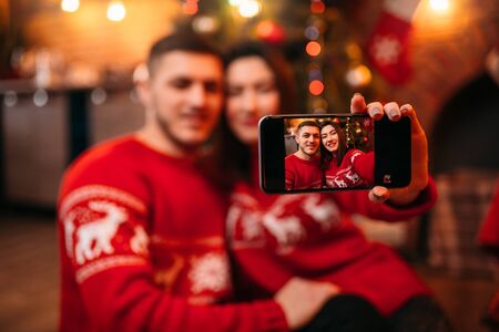Love couple makes selfie, xmas celebrationの写真素材