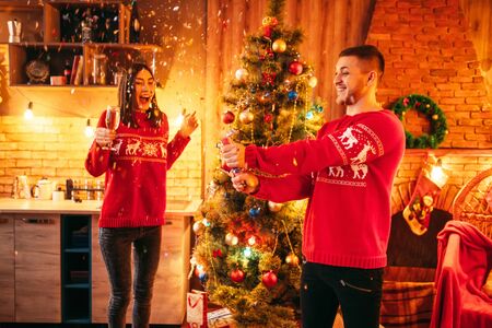 Love couple, man blows up a firecracker, christmas