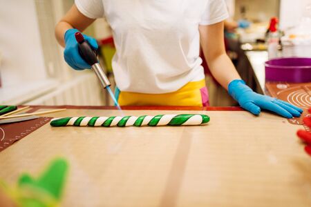 Chef melt caramel with a gas burnerの写真素材