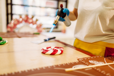 Chef melt caramel with a gas burnerの写真素材