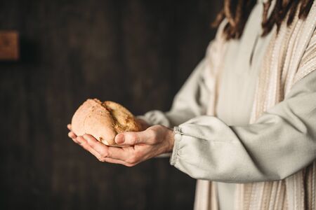 Jesus Christ with bread in hands, sacred foodの写真素材