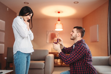 Young man makes an offer to surprised woman