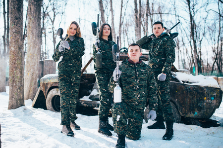 Paintball team poses with marker gunsの写真素材