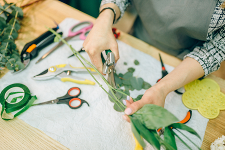 Female florist, bouquet preparation processの写真素材