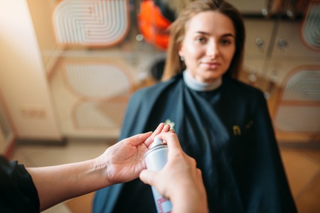 Stylist is preparing to apply mousse, hairdressingの写真素材