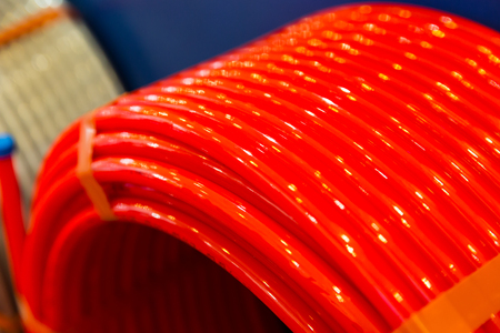 Roll of of plastic pipe in plumbing shop, pvcの写真素材