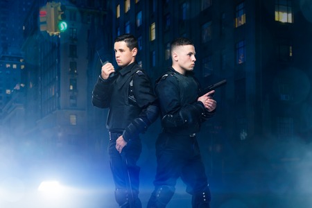 Special force poses with gun and transmitterの写真素材