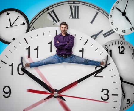 Man sitting on the twine between arrows of clock