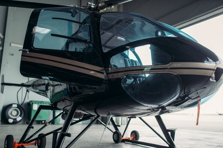 Small helicopter in hangar, private airline copterの写真素材