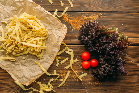 Uncooked pasta on wooden table closeup, nobodyの写真素材