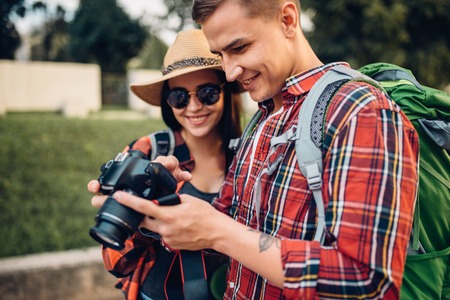 Travelers with backpack look at the pictures takenの写真素材