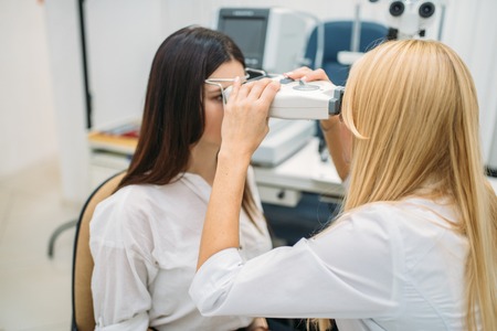 Eyesight test in optician cabinet, ophthalmology