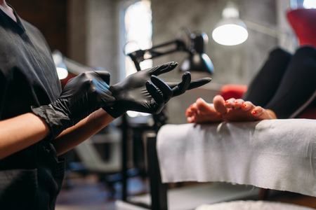 Pedicure master prepares for procedure with clientの写真素材