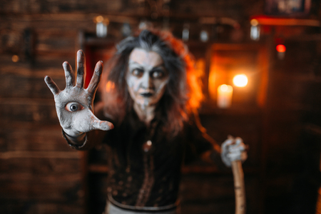 Scary witch with an eye in the palm, seanceの写真素材