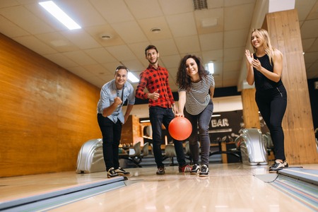 Male bowler throws ball, throwing in actionの写真素材