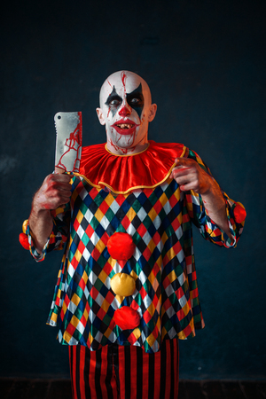 Bloody clown with meat cleaver and baseball batの写真素材
