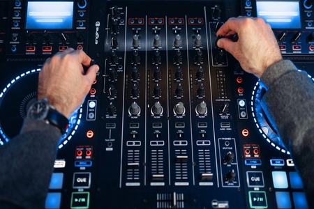 Sound operator hands over the remote controlの写真素材