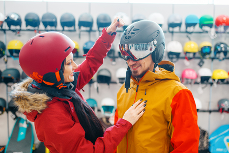 Couple check the strength of the ski helmetの写真素材