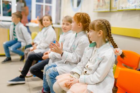 Children learning doctor profession in classroomの写真素材