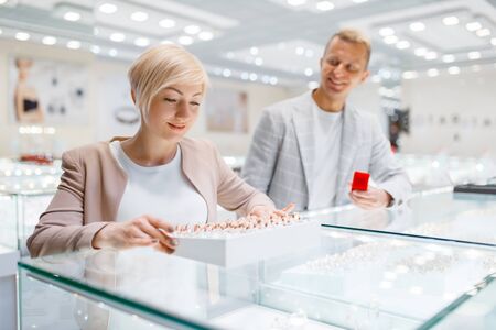 Couple purchase wedding rings in jewelry storeの写真素材