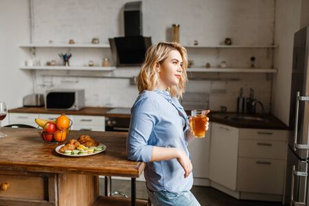 Woman having breakfast with croissants and cookiesの写真素材