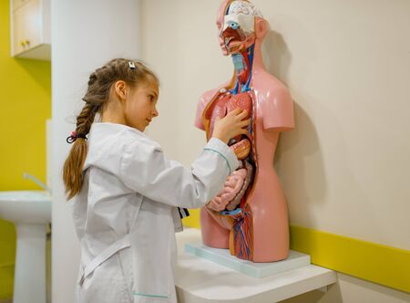 Cute girl playing doctor, playroomの写真素材