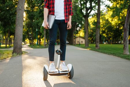 Young man riding    summer park