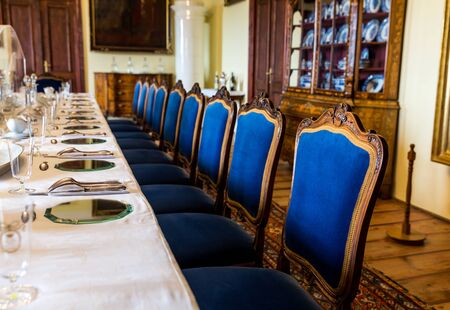 Dining room with appliances laid out on the table, Europe museum, nobody. Old european architecture and style, famous places for travel and tourismの写真素材
