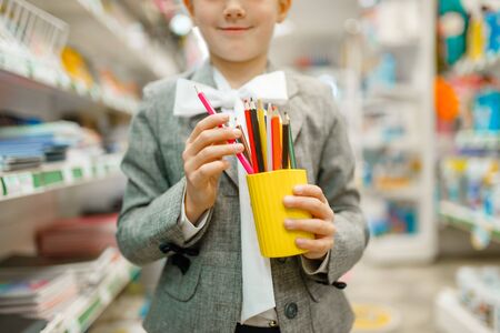 Schoolgirl with colorful pencils, stationery storeの写真素材