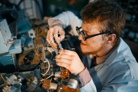 Scientist prototyping electrical device in labの写真素材