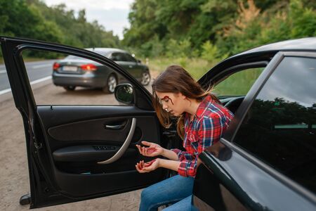Female driver with broken eyebrow after accidentの写真素材