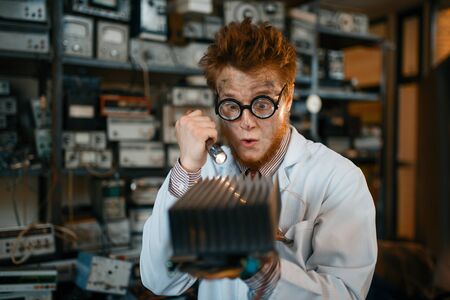 Strange engineer examines the cooling radiatorの写真素材
