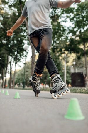Roller skating, skater rolling around the conesの写真素材
