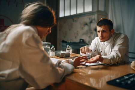 Psychiatrist and female patient, mental hospital