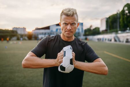 Evil male soccer player crumpled the ball