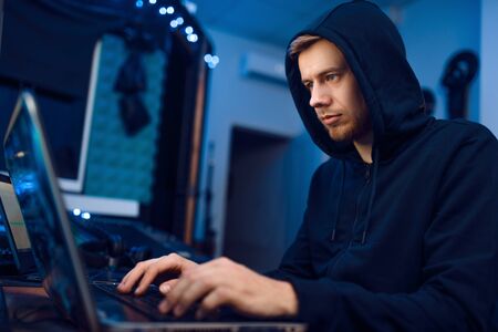 Programmer working on laptop, computer technology