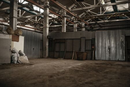 Abandoned factory corridor, grunge interior, nobody. Old broken industry building, empty industrial houseの写真素材