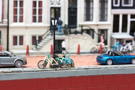 Bicycles at the lamppost on city street, miniatureの写真素材