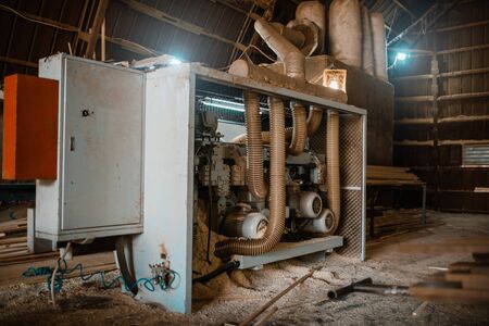 Woodworking machine in sawdust, nobody, sawmill
