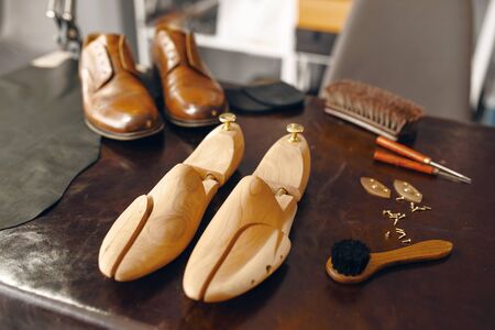Shoemaker tools, footwear repair service, nobody. Shoemaking workshop, bootmaker equipment on the...
