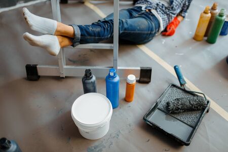 Cheerful woman makes home repairの写真素材