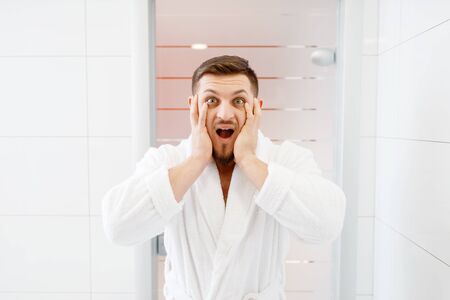 Bearded man frightened by his appearance, hygieneの写真素材