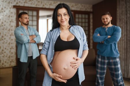 Pregnant woman with belly, two men on background