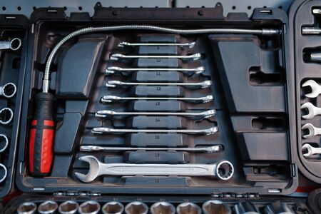 Toolbox with ratchet heads in tool store closeup
