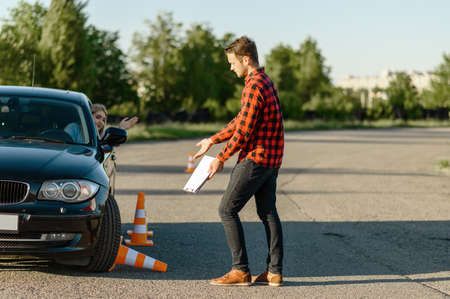 Female student knocks down traffic coneの写真素材