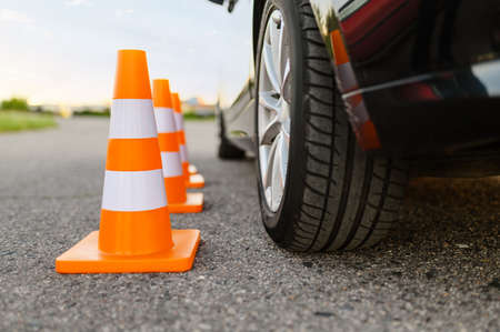 Car and traffic cones, driving school conceptの写真素材